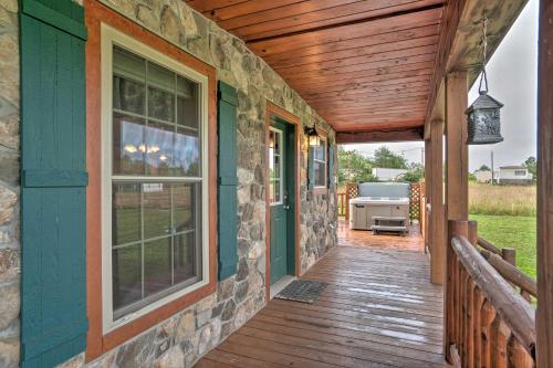 Rustic Benezette Cabin with Porch, Hot Tub and Fire Pit