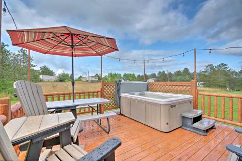 Rustic Benezette Cabin with Porch, Hot Tub and Fire Pit