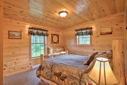 Rustic Benezette Cabin with Porch, Hot Tub and Fire Pit