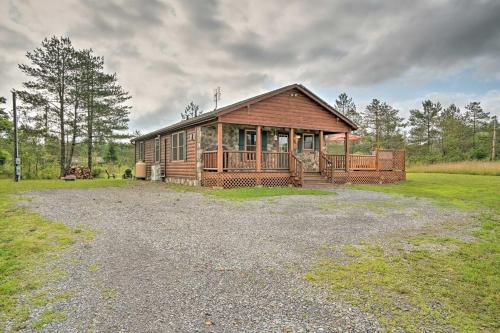 Rustic Benezette Cabin with Porch, Hot Tub and Fire Pit