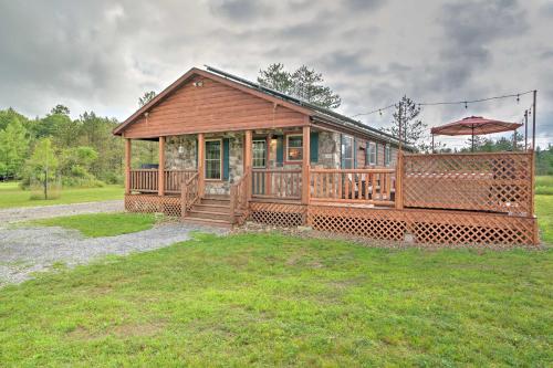 Rustic Benezette Cabin with Porch, Hot Tub and Fire Pit