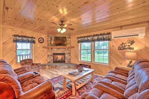 Rustic Benezette Cabin with Porch, Hot Tub and Fire Pit