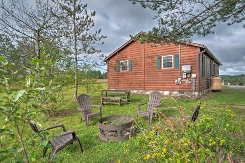 Rustic Benezette Cabin with Porch, Hot Tub and Fire Pit