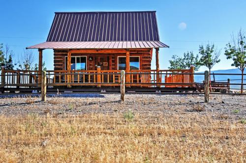 Remote Antimony Log Cabin with Green Meadow Views!