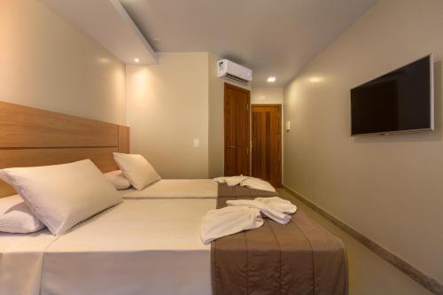 Quinta do Sol Praia Hotel Stop at Hotel Quinta do Sol Beach to discover the wonders of Porto Seguro. The hotel offers guests a range of services and amenities designed to provide comfort and convenience. 24-hour front desk, lu