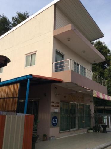 a building with a large window on the side of it, Sornwaree Apartment in Kanchanaburi