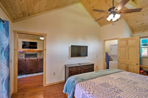 Charming Riverfront Cabin with Private Deck and Hot Tub