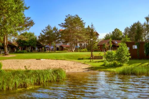 Domki Mazurskie w Ogrodach Złotej Łani Wiartel - Klimatyczne Apartamenty i Pokoje Widokowe