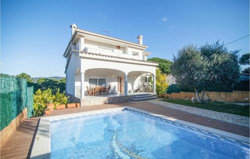 Awesome home in Santa Cristina d'Aro with Outdoor swimming pool and 4 Bedrooms gîte à louer El Mas Trempat