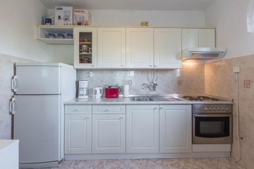 Apartment Paola for max 7 Pax with 3 bedrooms large garden and spacious balconies overlooking the se