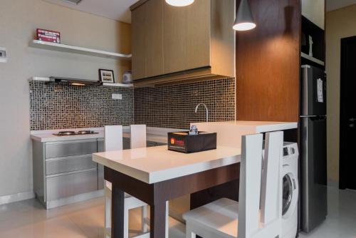 Best Price 2BR Apartment at Brooklyn Alam Sutera By Travelio - image 2