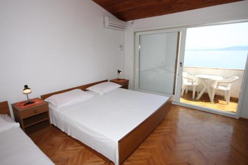 Apartments by the sea Igrane, Makarska - 6653