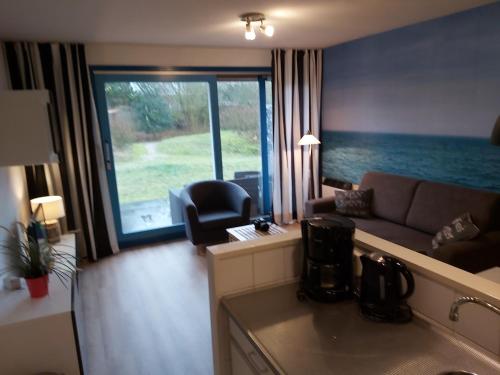 Appartementen 't STRANDHUYS en DE VUURTOREN, met VERWARMD ZWEMBAD, eigen KEUKEN, ZONNIG TERRAS nabij in Ameland