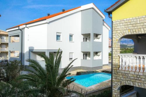 Family friendly apartments with a swimming pool Novalja Pag - 17228 