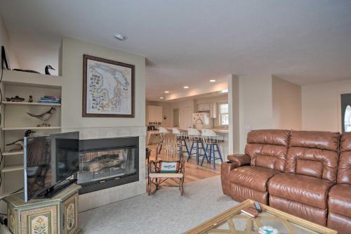 Lakefront De Tour Village Home with Deck and Fire Pit!