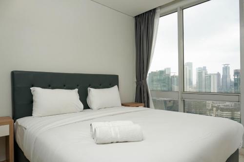 Comfortable Deluxe 2BR at The Empyreal Condominium Epicentrum Apartment By Travelio, Джакарта