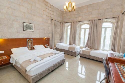 Family Room (1 Double Bed + 3 Single Beds) room in Azzahra Hotel Jerusalem