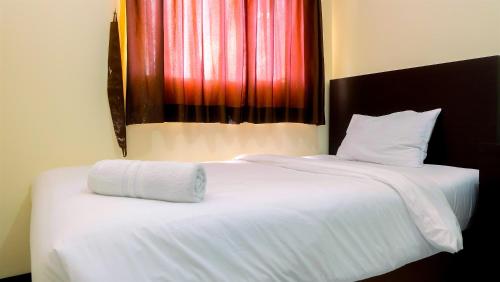 Strategic and Cozy 2BR The Wave Apartment By Travelio