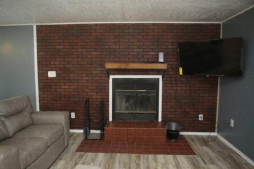 1 bedroom with a fireplace close to base