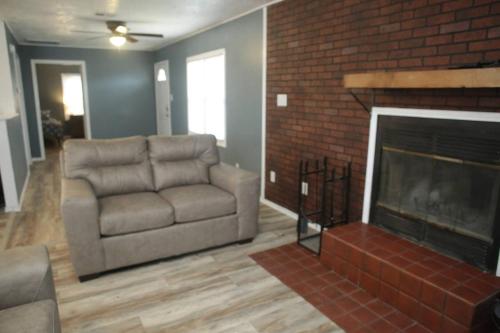 1 bedroom with a fireplace close to base