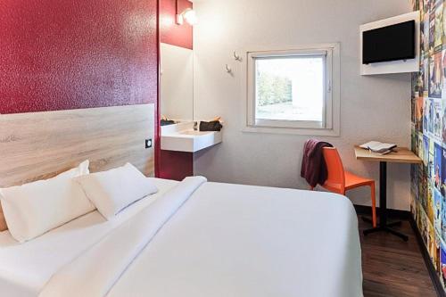 a hotel room with a white bed and white walls, hotelF1 Saint Malo in Saint-Malo
