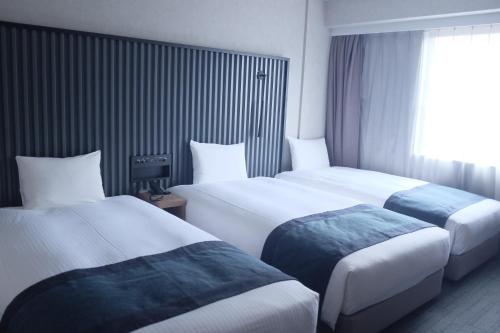 20sqm Deluxe Triple Room on High Floor - Non-Smoking