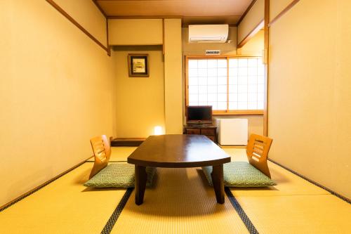 Japanese-Style Twin Room room in Yamadaya Ryokan