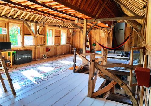 Shared lounge/TV area, The Rabbit Tree Hostel in Gili Meno