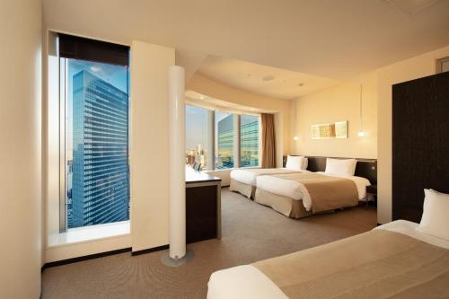 Deluxe Triple Room with 2 Single Beds and 1 Sofa Bed - Non Smoking - Above 26th floor