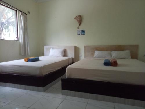 Amed Stop Inn Homestay, Rooftop Restaurant and Bar in Amed