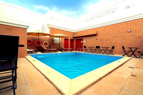 Swimming pool, Al Liwan Suites Rawdat Al Khail in Al Muntazah