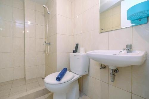 Homey 2BR Apartment at Springlake Summarecon Bekasi By Travelio - image 3