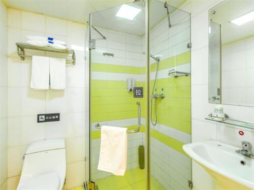 a bathroom with a shower, sink, and toilet, 7 Days Inn Beijing Shangdi Branch in Beijing