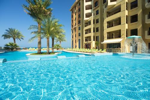 Swimmingpool, Pullman Resort Al Marjan Island in Ras Al Khaimah