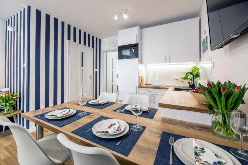 Apartament 12B Niebieskie Apartamenty Poddąbie z basenem krytym, odkrytym, salą zabaw, animacjami