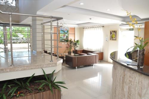 ล็อบบี้, Lotus Hotel - à 6 km do Santuário de Aparecida-SP (Lotus Hotel - a 6 km do Santuario de Aparecida-SP) in กวาราตินกิวต้า