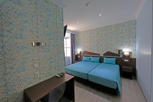 Triple Room with Private Bathroom room in Pensao Praca Da Figueira