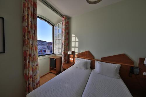 Double or Twin Room with Private Bathroom room in Pensao Praca Da Figueira