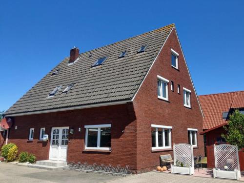 B&B Dornumersiel - Pension An der Reling - Bed and Breakfast Dornumersiel