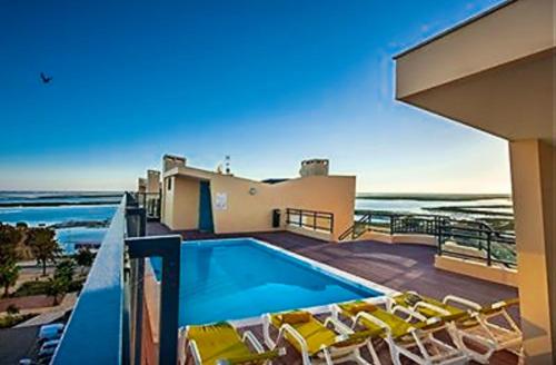 Village Marina, Olhao, Appartement 4 personnes PISCINE, Ferienwohnung in Olhão