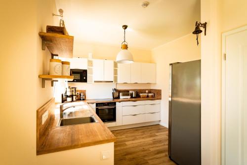 ห้องครัว, Luxusferienhaus Fuchsbau - mit Netflix, PlayStation, Sauna, Sportraum und Kamin near สนามบินเฮริงสดอร์ฟ