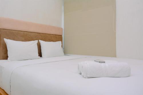 Cozy and Lovely 2BR Green Bay Pluit Apartment By Travelio