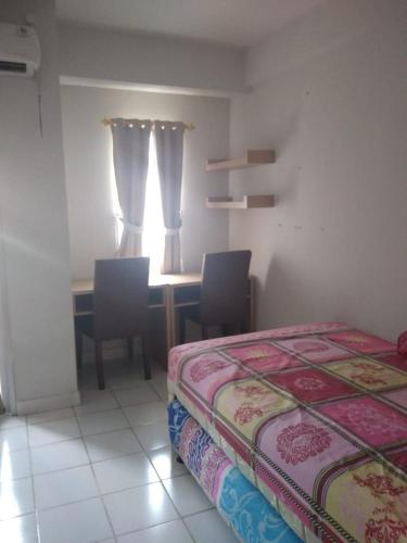Merry drmaga tower apartemen