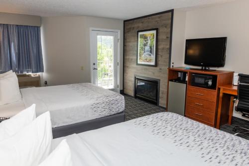 Queen Room with Two Queen Beds w/ fire place & private balcony