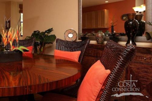 Luxe! Impressively designed 2nd-floor unit in Coco done in red and orange hues
