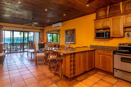 Warm Interiors and Orange Hues on Ground Floor in Front of Beach