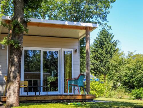 Erkély/terasz, Camping Wedderbergen in Verspreide huizen in de Weddermarke