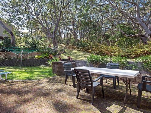 Adriana 3 unit with a backyard