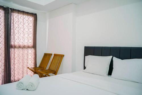 Fully Furnished and Homey Studio Casa De Parco Apartment By Travelio