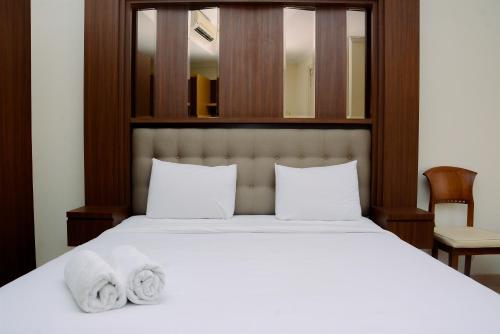 Fully Furnished and Minimalist Studio at Menteng Park Apartment By Travelio